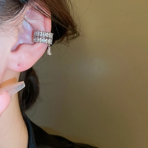 Silver ear cuff with cubic zirconia double rows and sparkling water drop pendant on ear
