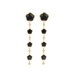 Elegant gold clover tassel earrings with five black floral charms on white background