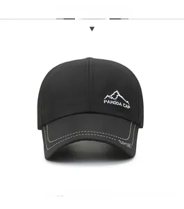 Detail of black breathable baseball cap with embroidered mountain logo and SPORT logo on brim