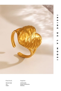 Detailed close-up of 18K gold plated heart ring with hammered texture and open band design