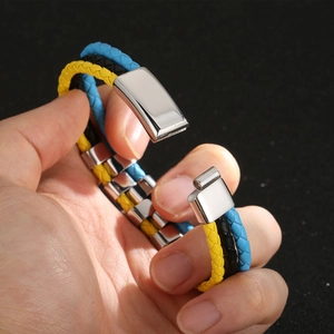 Detail of multi-layer braided leather bracelet with silver magnetic stainless steel clasp
