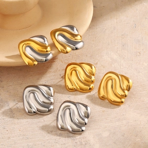 Three pairs of wave pattern square stud earrings in gold, silver, and two-tone finishes