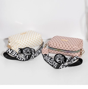 Detailed view of mini crossbody bags featuring stylish monogram pattern and wide woven straps