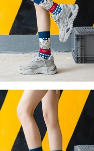 Detail of dark blue plaid lolita socks with cat embroidery and chunky grey sneakers