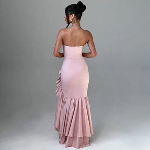 Detail of pink off-shoulder mermaid dress with elegant side ruffles and asymmetric hemline