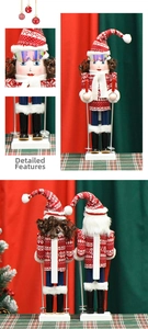 Detail of wooden nutcracker soldier in ski outfit with red sweater and scarf ornament