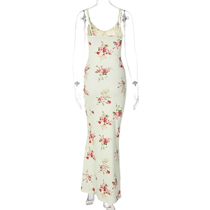 Back view of a long floral maxi dress featuring red rose patterns on a light green fabric