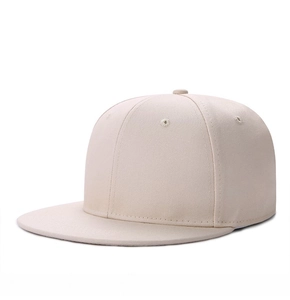Detail view of a beige hip-hop snapback hat with premium cotton twill texture and stitching