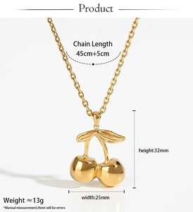 Detailed view of golden cherry necklace showing dimensions 32mm height and 45cm chain length