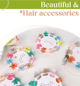 Close-up of colorful mini claw clips in star and butterfly shapes on display card