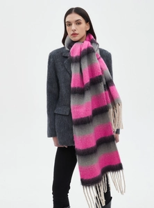 Detail view of thick striped knit scarf with pink and grey pattern and fringe tassels