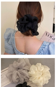 Detail view of stylish chiffon hair scrunchies in black grey and beige colors