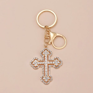 Golden cross keychain with sparkling white rhinestones and secure lobster clasp charm