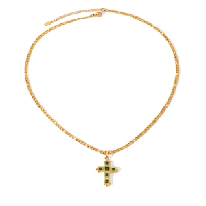 Detail of gold cross pendant with green gemstone and lobster clasp on link chain