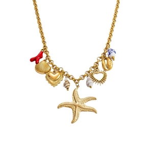 Gold chunky necklace with starfish, conch shells and coral ocean charms on white background