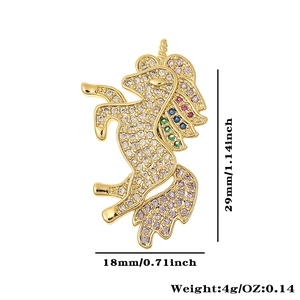 Detail view of gold unicorn brooch with zircon inlay showing 29mm height and 18mm width