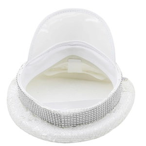 Close-up of white sequined party hat showing interior lining and rhinestone brim detail
