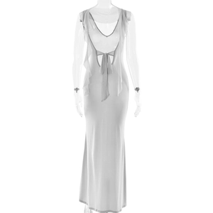 Detail of white maxi dress showing ruffle accents and open back tie closure