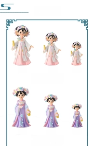 Detail view of Chinese style Hanfu doll figurines in pink and purple outfits
