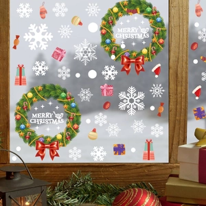 Christmas wreath static window stickers with snowflakes and festive holiday scene on glass