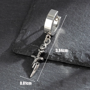 Silver gothic feather hoop earrings with skull charm for men and women on stone surface