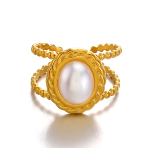 Vintage style gold stainless steel ring featuring an oval pearl and beaded texture