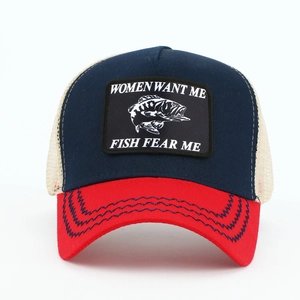 Detail of a mesh trucker hat featuring a funny fish patch with bold contrast colors