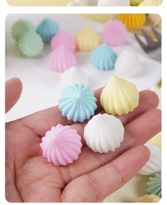 Macro shot of colorful resin meringue dollhouse sweets for DIY craft decorations
