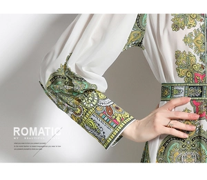Detail of bohemian floral puff sleeves and waisted cut on a vintage white dress