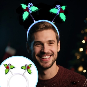 LED Christmas headband with green holly leaves and striped candy canes in glowing blue light