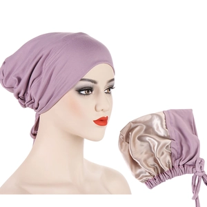 Detail view of deep purple hair wrap with soft champagne satin lining and adjustable ties