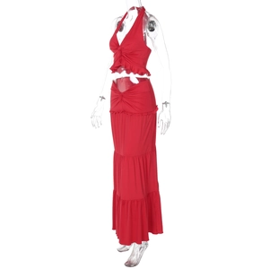 Detail of red two-piece set featuring a knot design and tiered ruffle maxi skirt