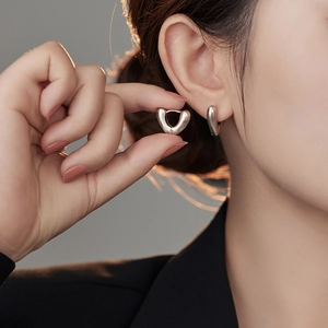 Minimalist silver heart-shaped hoop earrings with a polished vintage V-shape design
