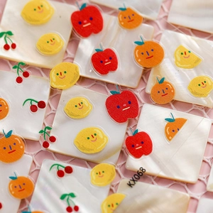 5D fruit nail art stickers with cute 3D apple and cherry designs on pink grid