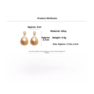 Detailed view of teardrop alloy earrings showing texture, 9.9g weight and 3.7cm size