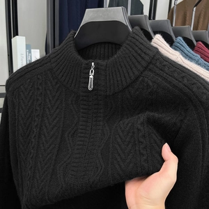 Close-up of black cable knit sweater featuring a stand collar with premium zipper detail