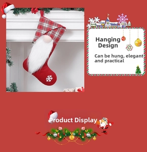 Detail of red Christmas stocking with white gnome beard and snowflake embroidery patterns