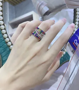 Macro shot of wide S925 sterling silver ring with colorful square zirconia gemstones