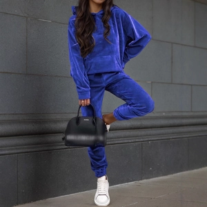 Women's dark blue velvet tracksuit set featuring long sleeve hoodie and jogger pants