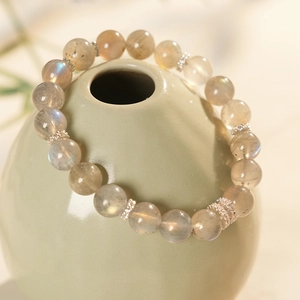 Macro shot of natural labradorite beaded bracelet with ornate silver hollow spacer beads