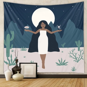 Detail of bohemian wall tapestry showing minimalist art illustration of a woman and starry moon