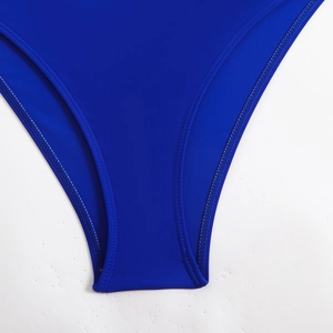 Detailed view of the double-needle stitching on royal blue high-elastic bikini bottom