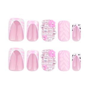Pink 3D wave press-on nails with pearls, leopard print patterns, and floral accents