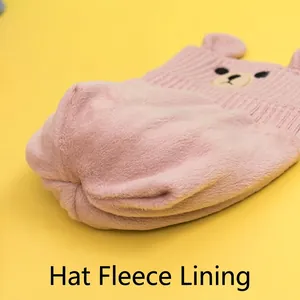 Pink knitted children's winter hat with warm fleece lining and cute bear ear details