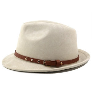 Detail of beige faux suede fedora with brown studded leather band and gold buckle