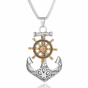 Detailed view of nautical anchor and golden helm pendant with polished silver finish
