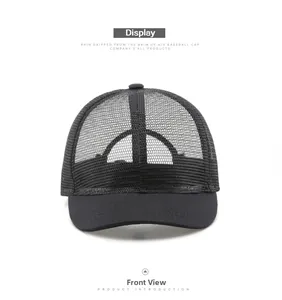 Front view detail of a black mesh trucker hat with breathable structure and curved brim