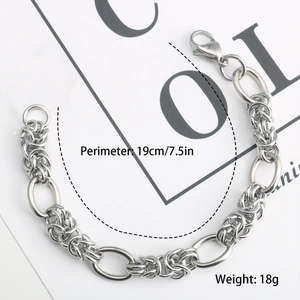 Silver metal chain bracelet with smooth oval links and textured weave rings