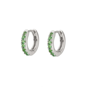 Macro detail of S925 sterling silver hoop earrings with pave-set green cubic zirconia