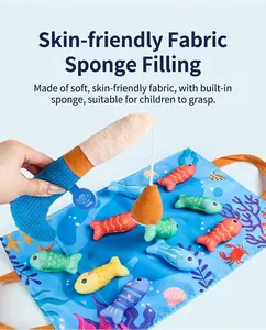 Close-up of baby magnetic plush fishing toy with colorful cloth fish and soft rod